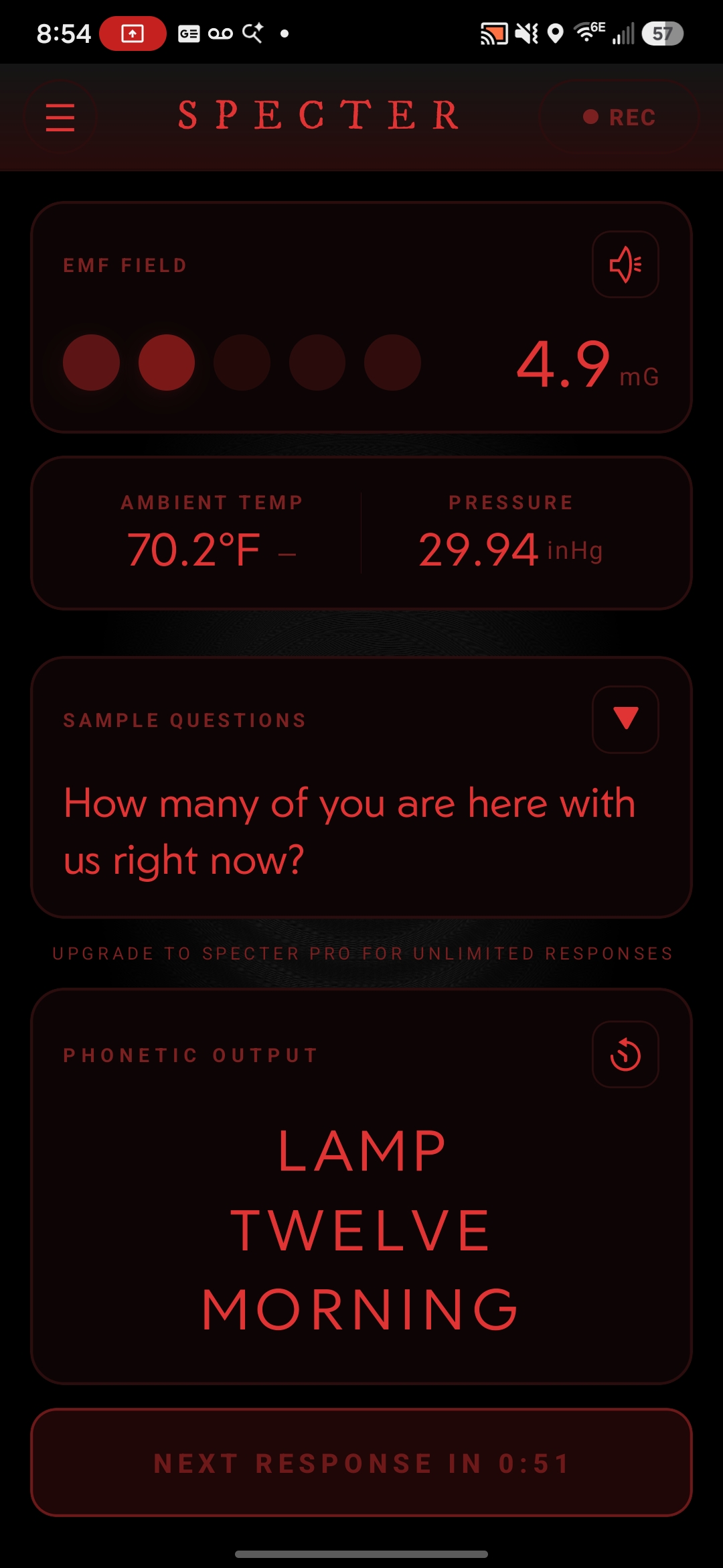 Specter in night mode, the whole interface rendered in red for night vision: an EMF reading of 4.9 mG, the sample question &ldquo;How many of you are here with us right now?&rdquo; and the phonetic output LAMP TWELVE MORNING